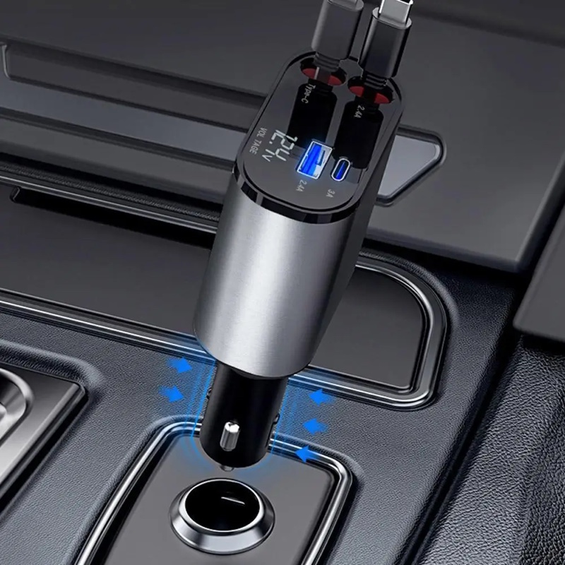 Fourfold Coil 120 going into a car's lighter socket, blue lights glowing round its plug