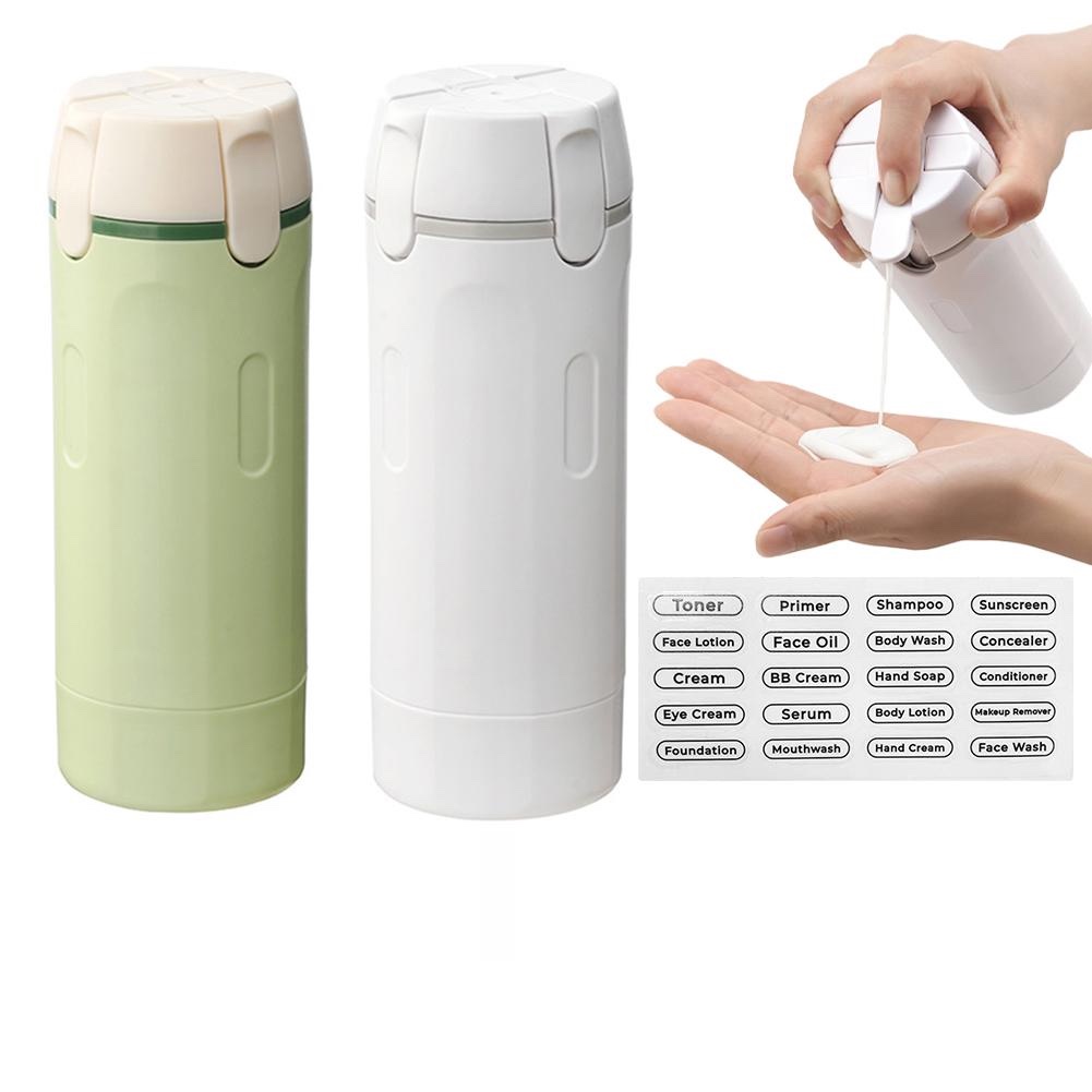 Fourfold Decant 4 in green and in white, a hand pumping lotion from one, beside a sheet of label stickers