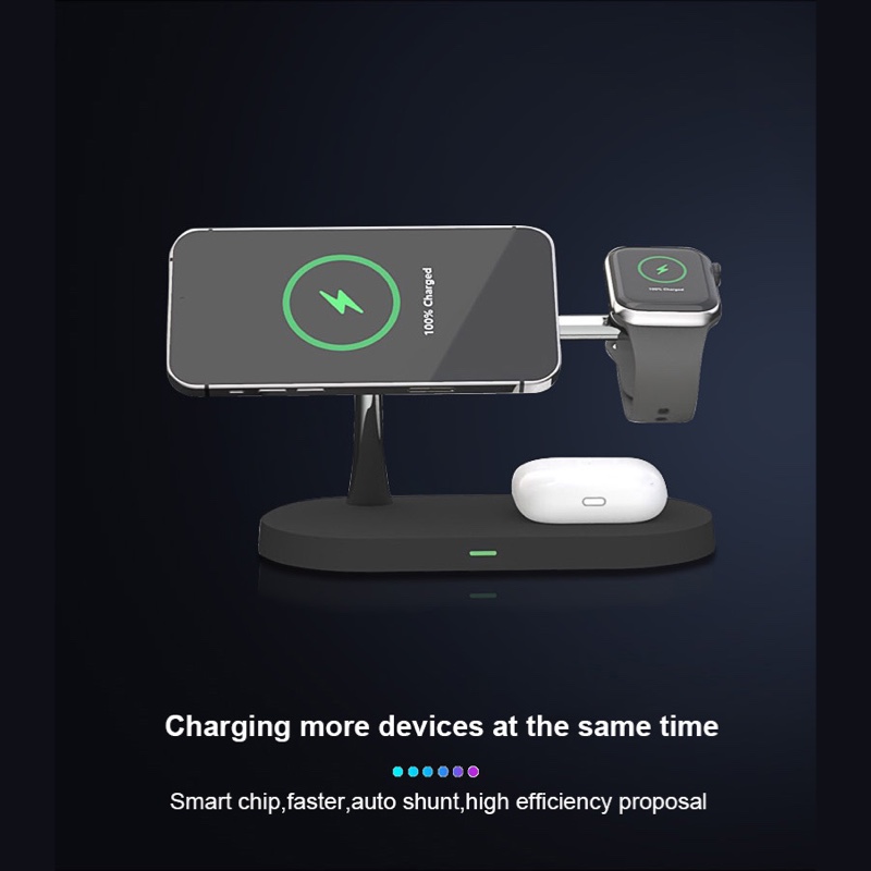 Fourfold Halo Dock in black on a dark background, charging a phone, a watch and earbuds at the same time
