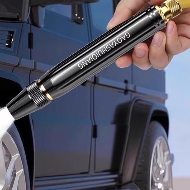 Fourfold Jetstream on a hose, its long nozzle spraying a jet at a car's wheel