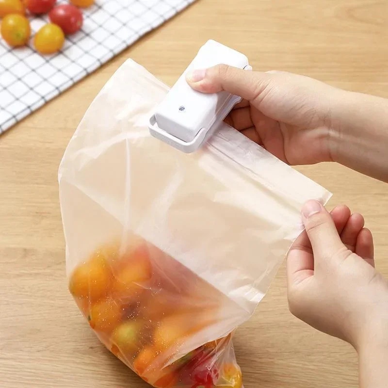 Fourfold Pinch sealing the top of a bag of cherry tomatoes