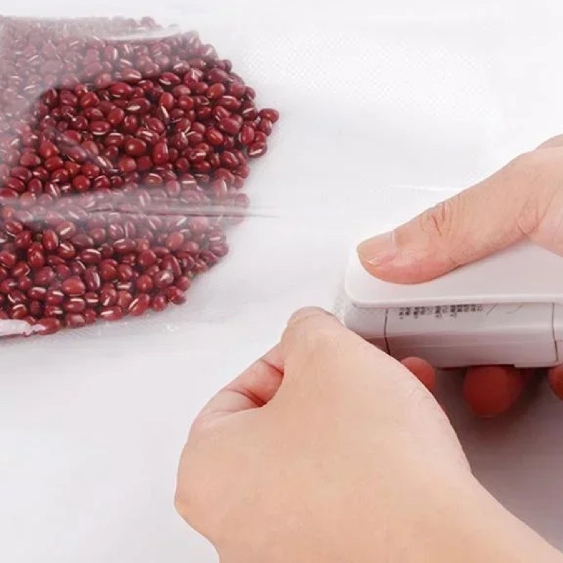 Fourfold Pinch slid along the edge of a bag of red beans to seal it